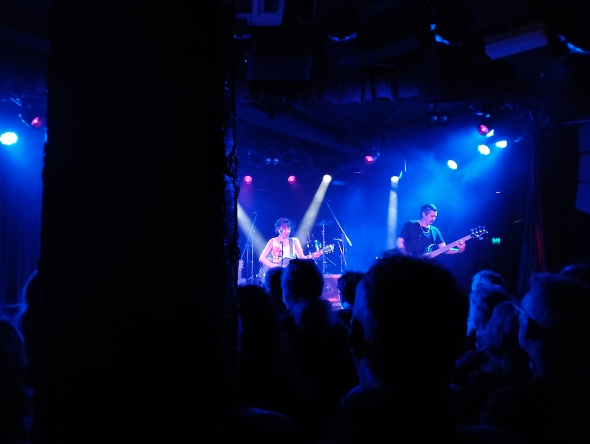 A poor photo of Throwing Muses on stage