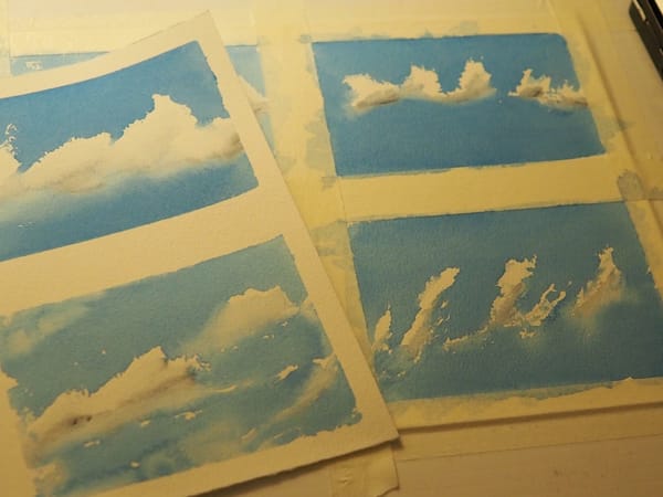Multiple watercolour paintings of clouds