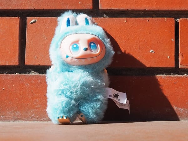 A blue fake labubu that's a bit wonky