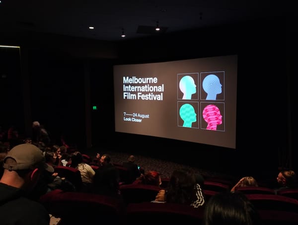 A darkened cinema with the MIFF title on screen